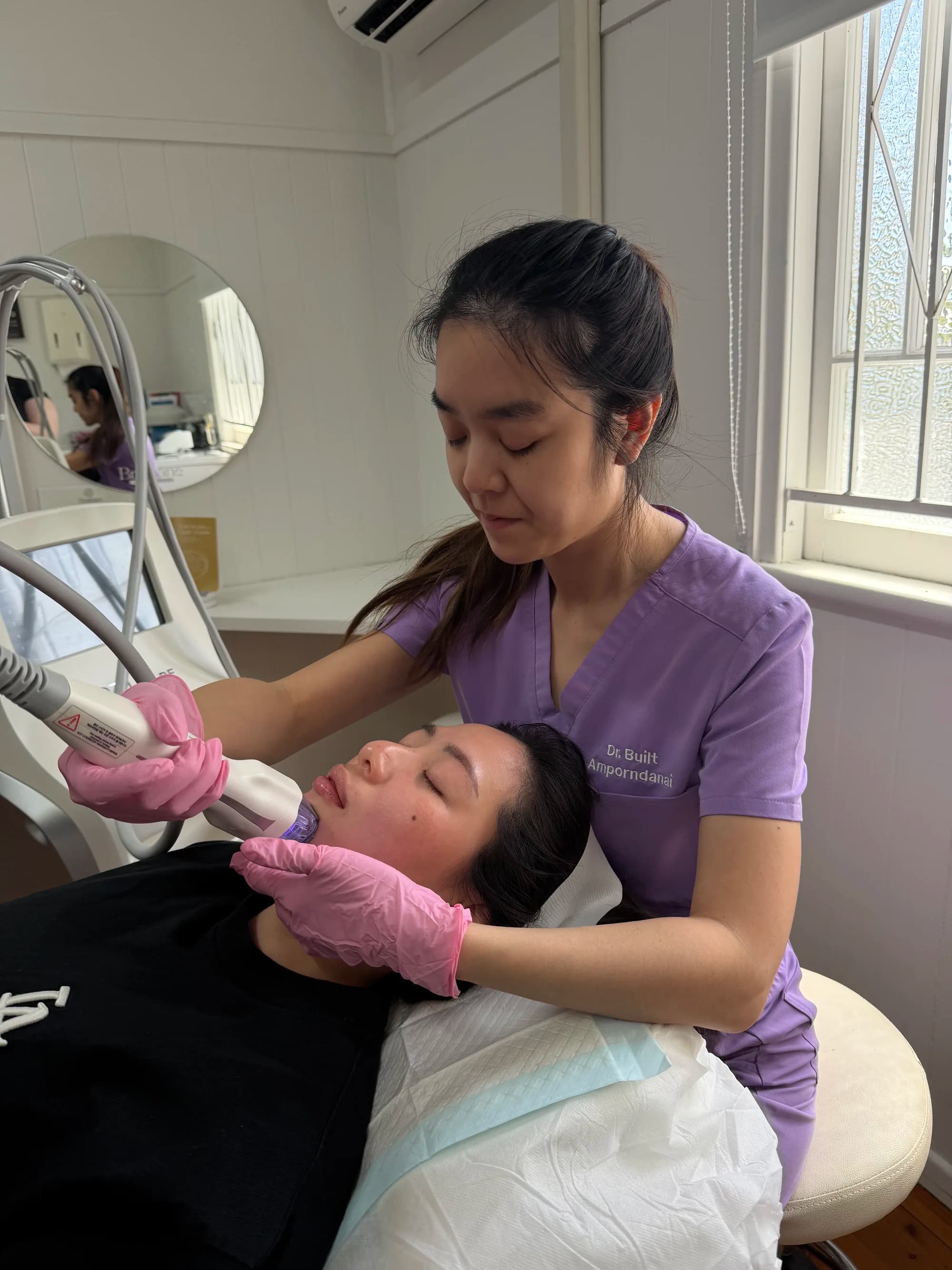 A practitioner reviewing an EVE MUSE skin analysis on screen during a Virtue RF consultation
