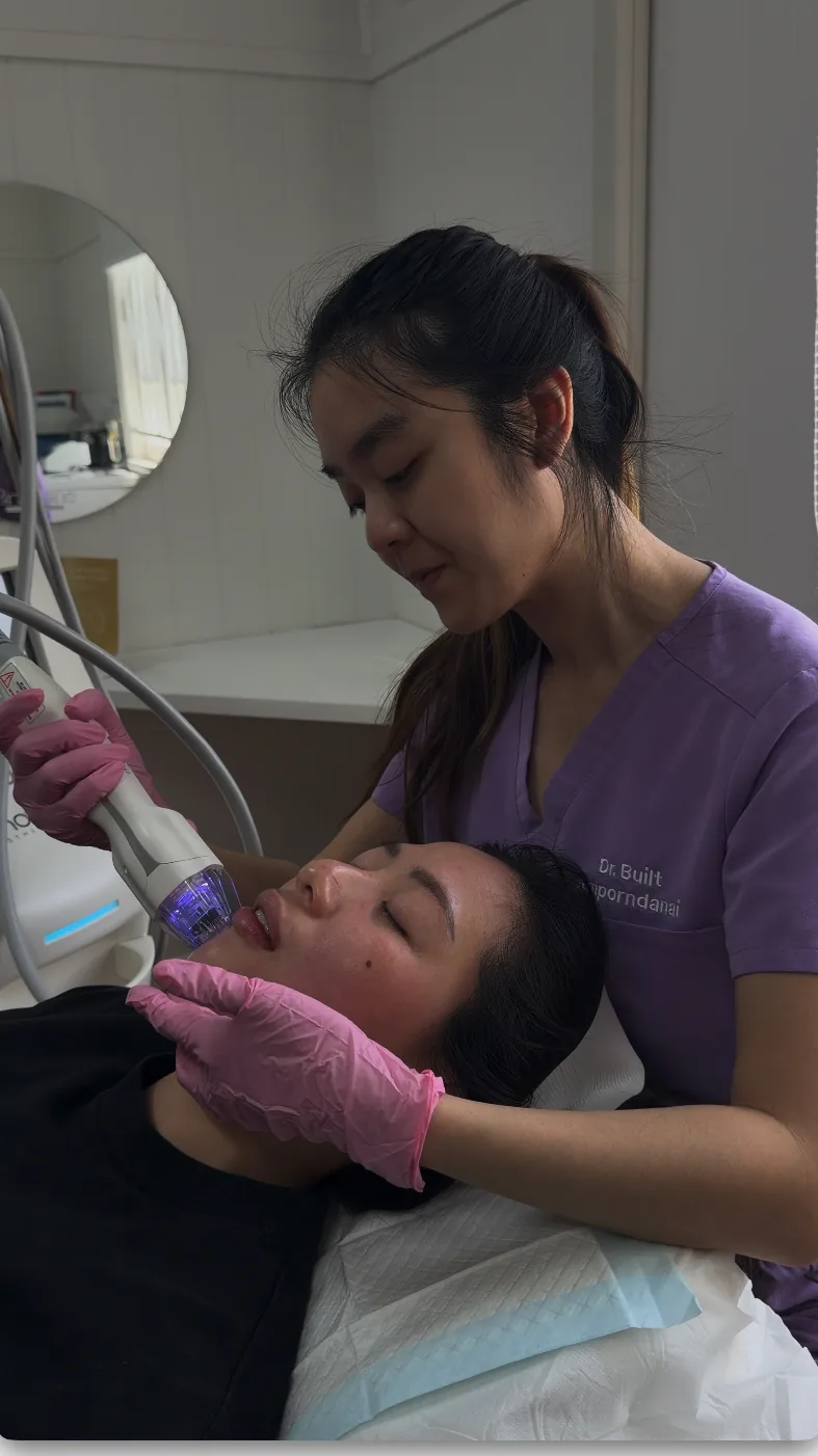 A qualified practitioner performing a Virtue RF microneedling treatment on a client's face at Brisbane Skin & Aesthetics